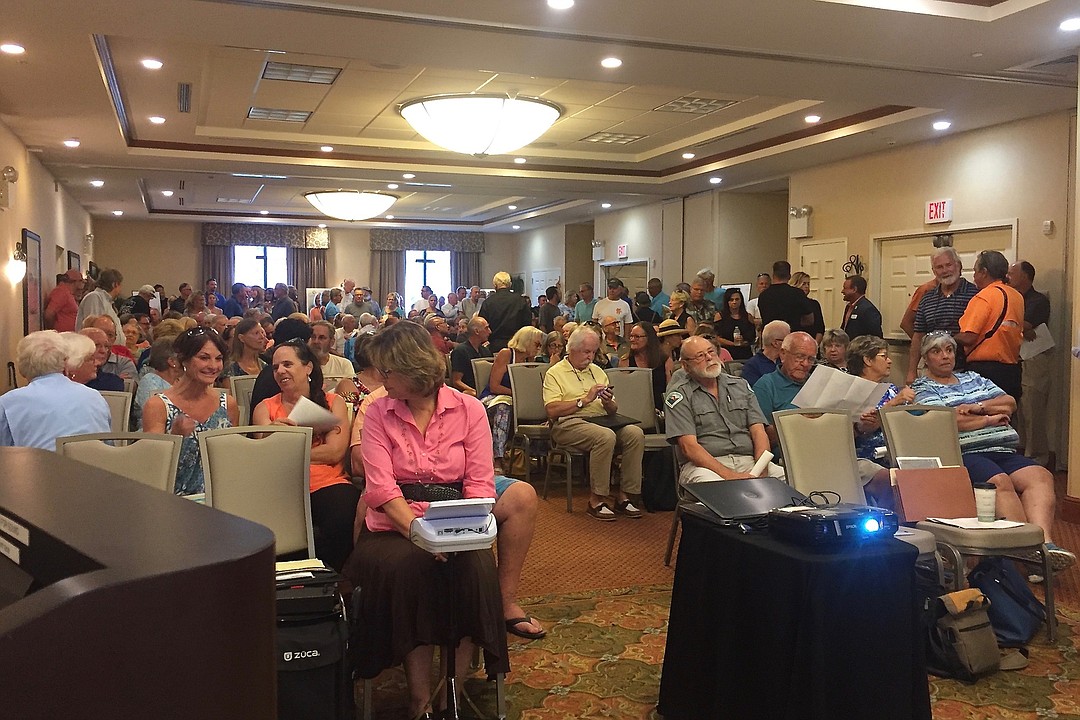 Overflow crowd denounces development planned for John Anderson Highway