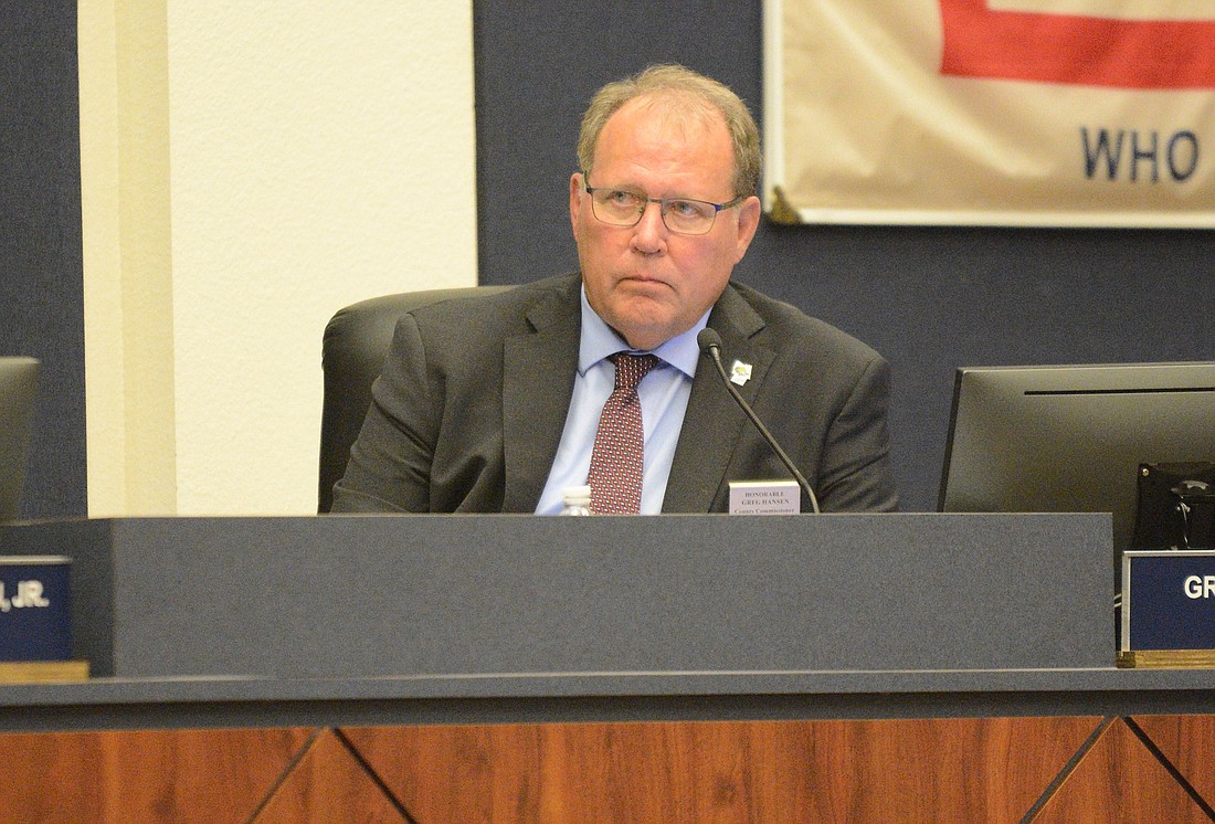 County Commissioner Greg Hansen listens to county staff at a commission meeting July 15. (Photo by Jonathan Simmons)