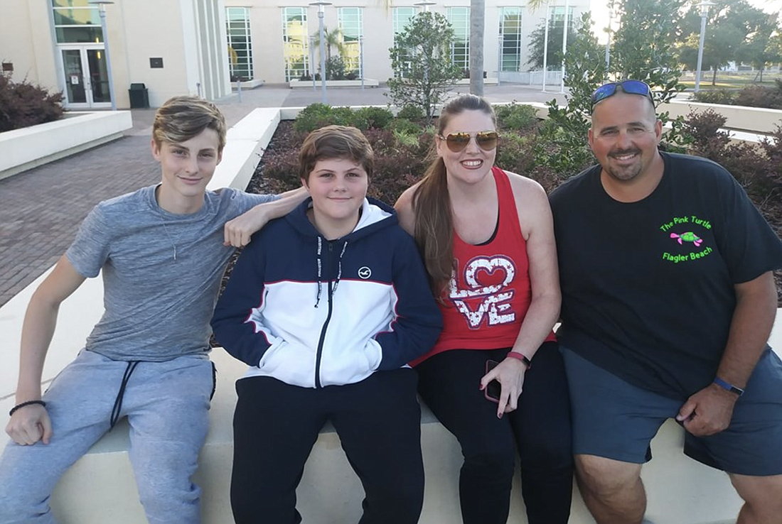 Thomas LeGault, right, with family outside the county courthouse. LeGault submitted this photo for his profile on the Supervisor of Elections Office website.