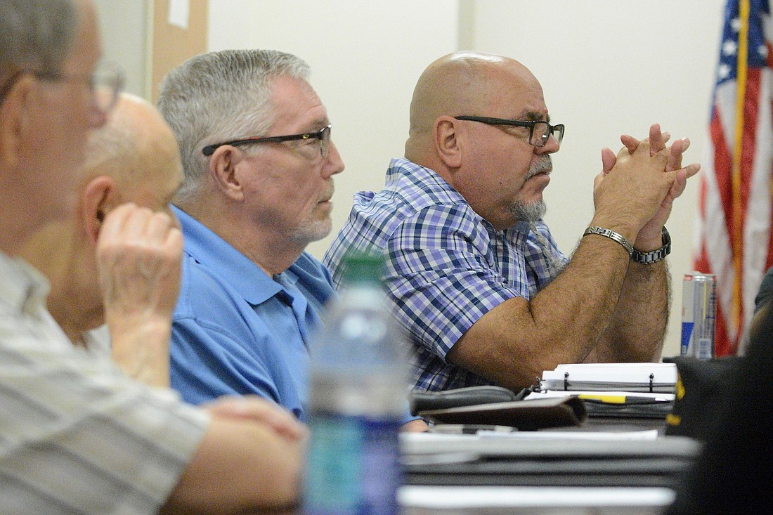 Eric Febles Flores, right, speaks during a Veterans Advisory Council meeting Aug. 5. (Photo by Jonathan Simmons)