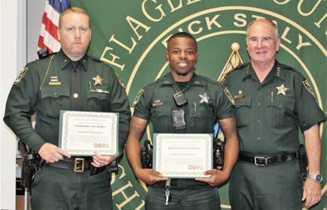 Cmdr. Jon Welker, Deputy Dedorius Varnes and Sheriff Rick Staly (Photo courtesy of the FCSO)