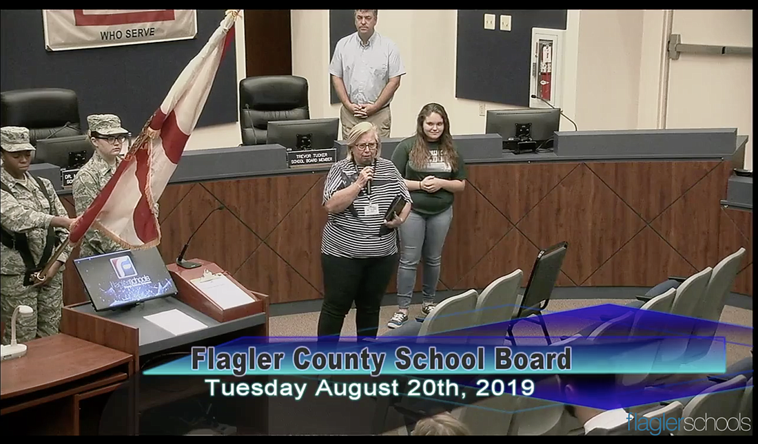 The Rev. Jeanine Clontz presents an invocation at the Aug. 20 Flagler County School Board meeting. (Image courtesy of Flagler Schools)