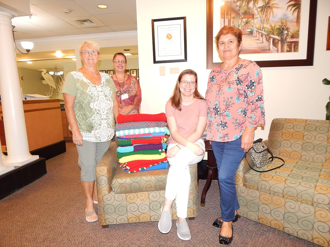 PACC members Maryann Thiel and Maria Caetano (far left and right) with Grand Oaks employees Diane Rodrigues and Emily Bertrand. Courtesy of PACC