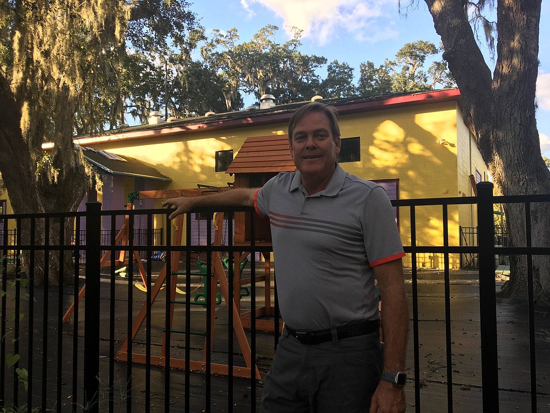 Nature Scapes owner David Matchett in front of Garden of Faith Preschool. Photo by Joey Pellegrino