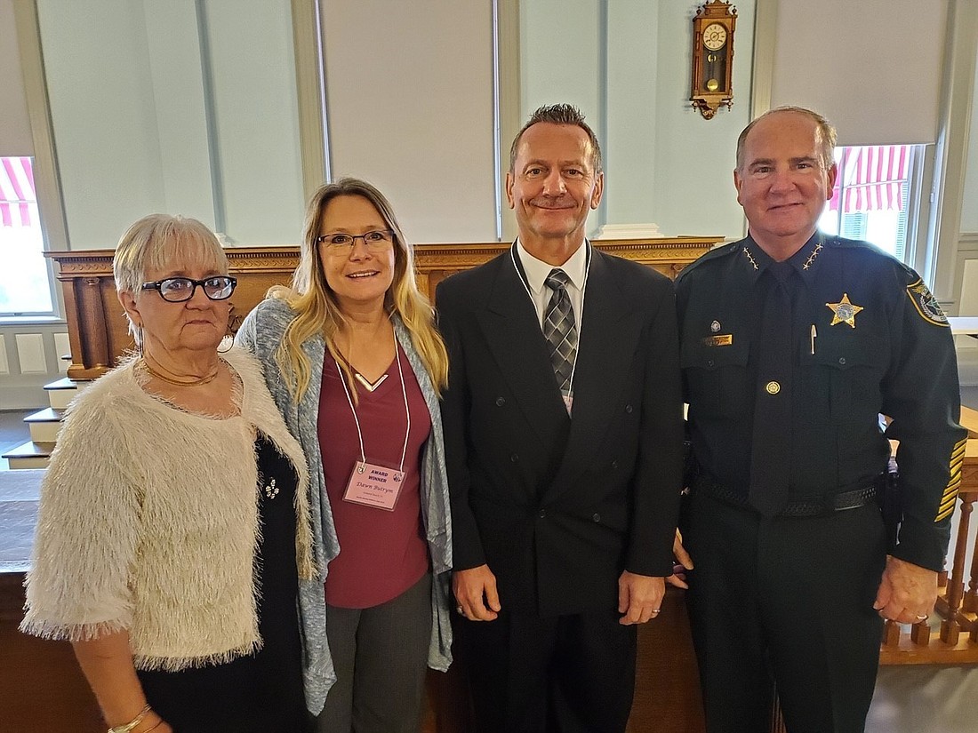 Gloria, Dawn Butrym, Anthony Butrym and Sheriff Rick Staly. Courtesy of Flagler County Sheriff's Office