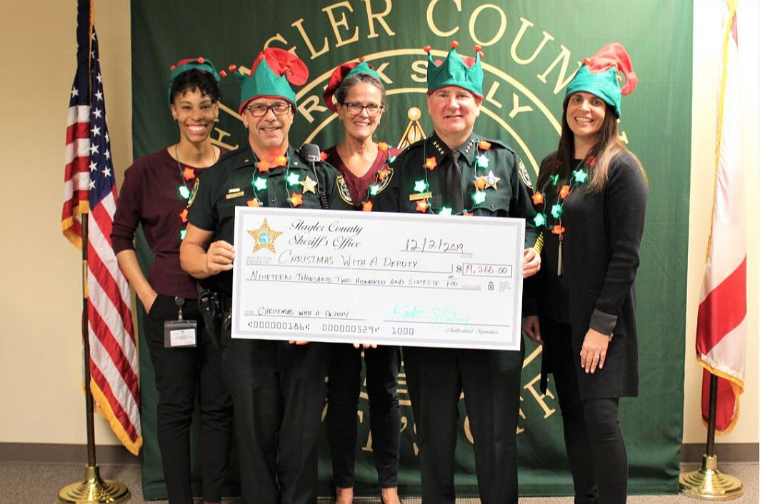 FCSO presents $19,266 to the 2019 Christmas with a Deputy program. From left: FCSO Victim Advocate Nicole Farmer, Commander Lou Miceli, Victim Advocate Kathy Vazquez, Sheriff Rick Staly and Victim Advocate Mary Dinardi.
