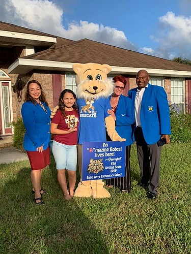 Jessica DeFord, far left, was named interim principal at Belle Terre Elementary School, replacing Terence Culver, far right. Photo from BTES Facebook page.