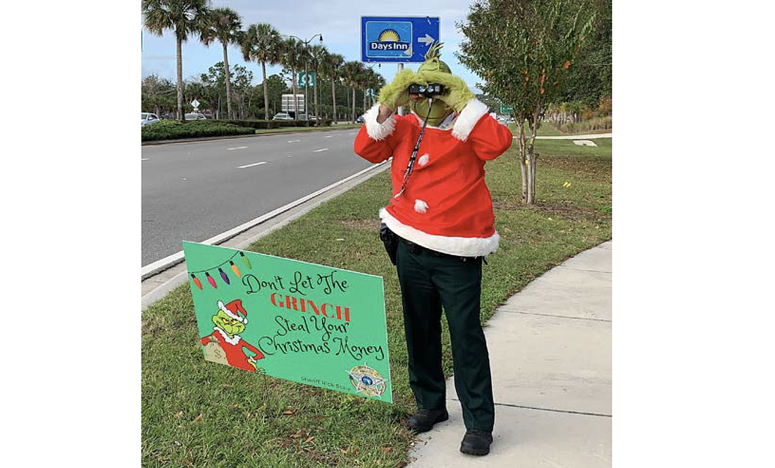 The Grinch assisted the Traffic Unit with a detail on Friday in Palm Coast. Photo courtesy of the FCSO