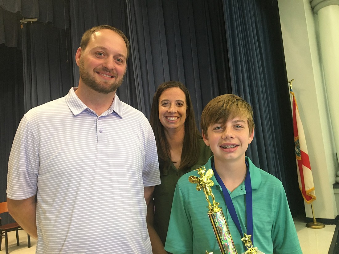 Josh and Rachel Rimpel with son and 2020 Flagler County spelling champion Caleb. Photo by Joey Pellegrino
