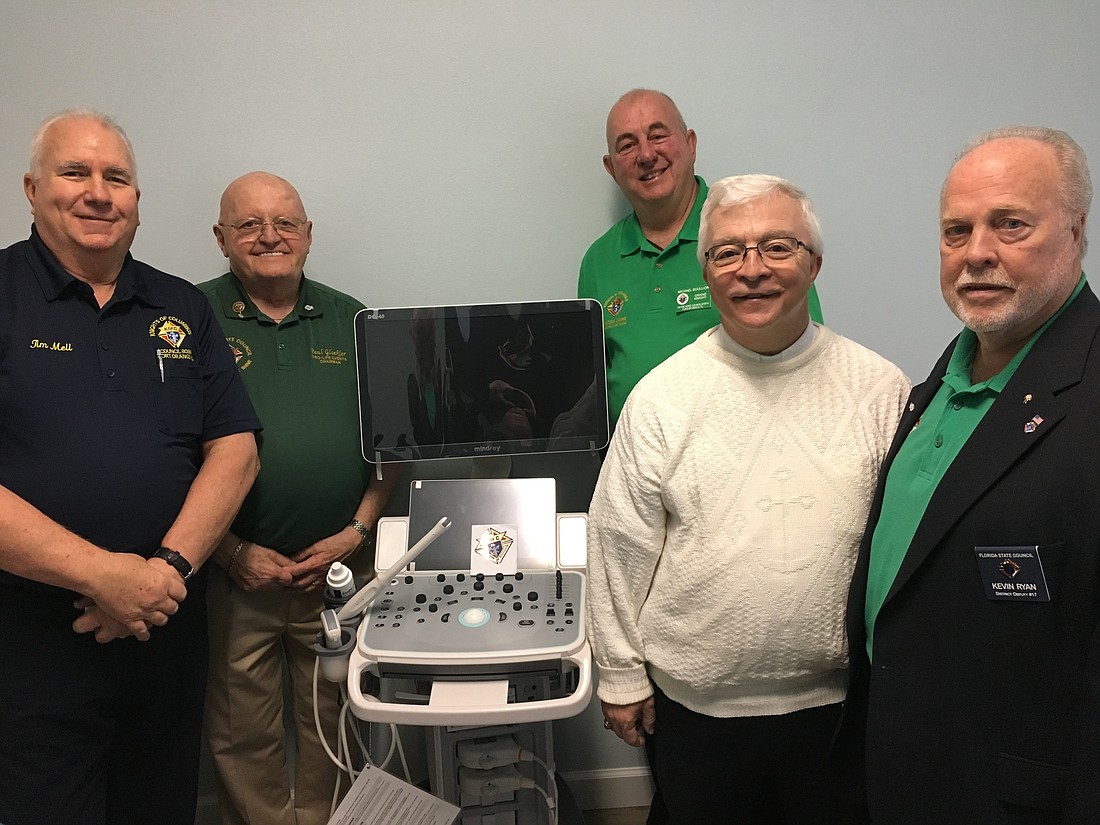 Knights Tim Mell, Paul Gloekler, Mike Boullion, Father Chris Hoffman and Knights of Columbus District 17 Deputy Kevin Ryan. Courtesy of Our Lady of Hope
