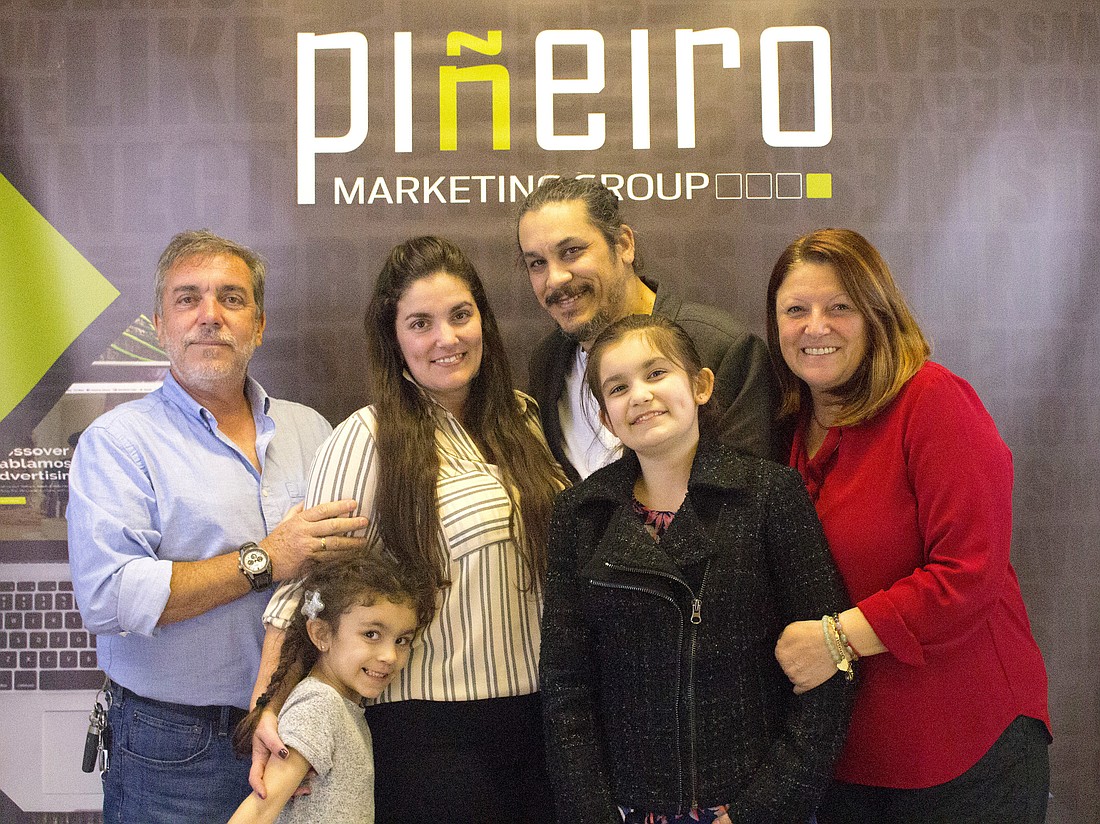 Ximena Alfaro and Rodrigo Pineiro pose with their children, Isabella and Angelina, as well as Alfaro's parents, Gerardo and Soraya Alfaro. Email info@pineiromg.com. Courtesy photo
