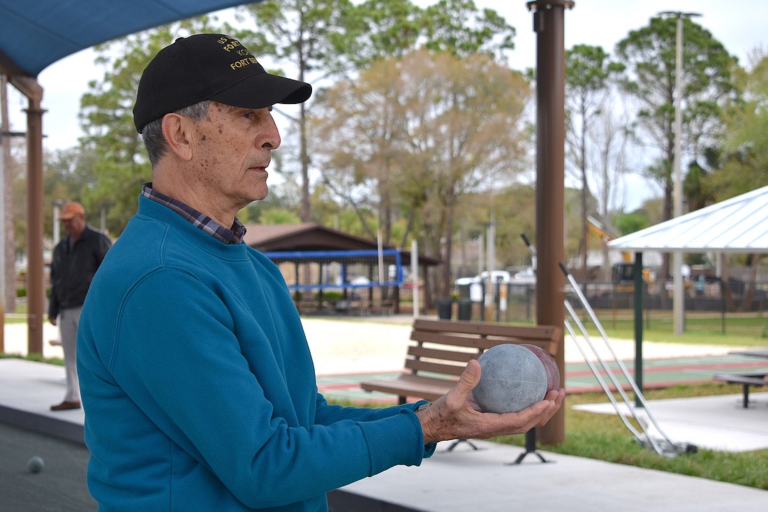 Victor Cannizzaro tries out the newly improved bocce ball courts at Holland Park. Photo courtesy of the city of Palm Coast
