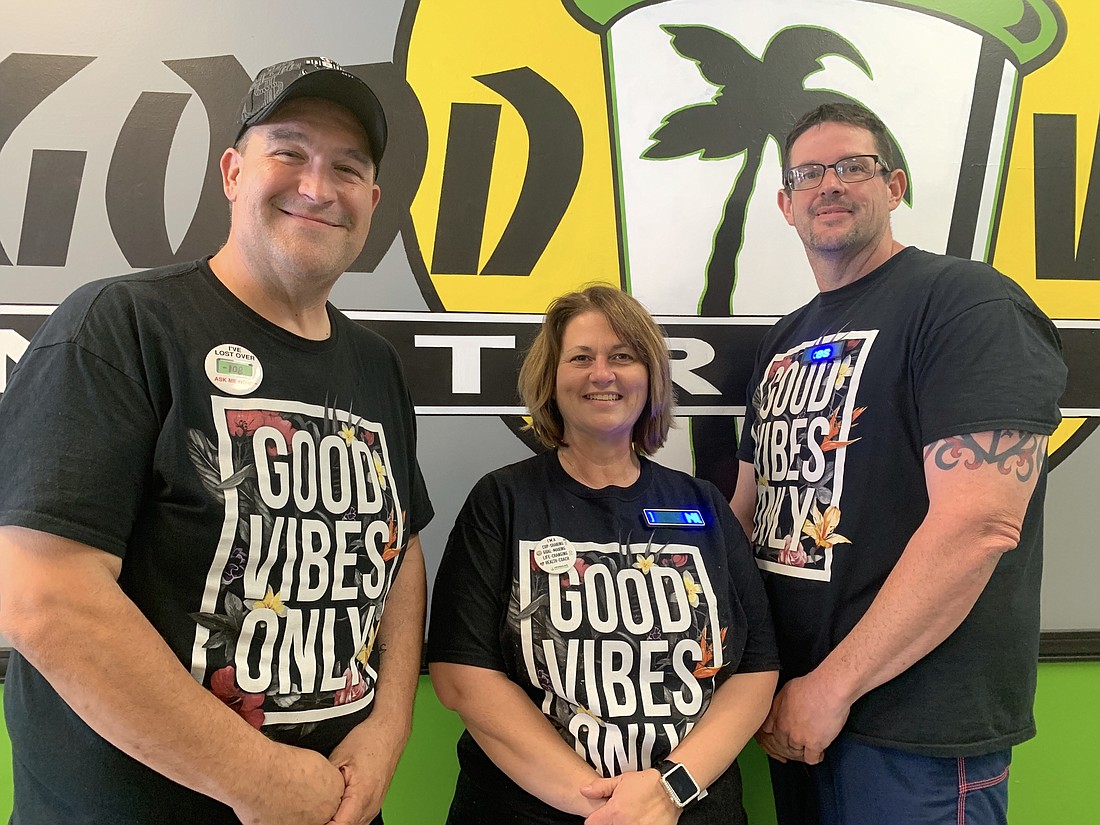 Good Vibes owner Michael Granam went to school for graphic design and was able to put his skills to use in several graphics at his new store. He is joined by operators Teresa Williams and Chris Murphy. Photo by Brian McMillan
