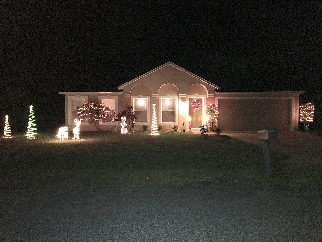 The Stricklands are hoping others will light up their own homes like they did theirs at 67 Round Thorn Drive. Courtesy photos