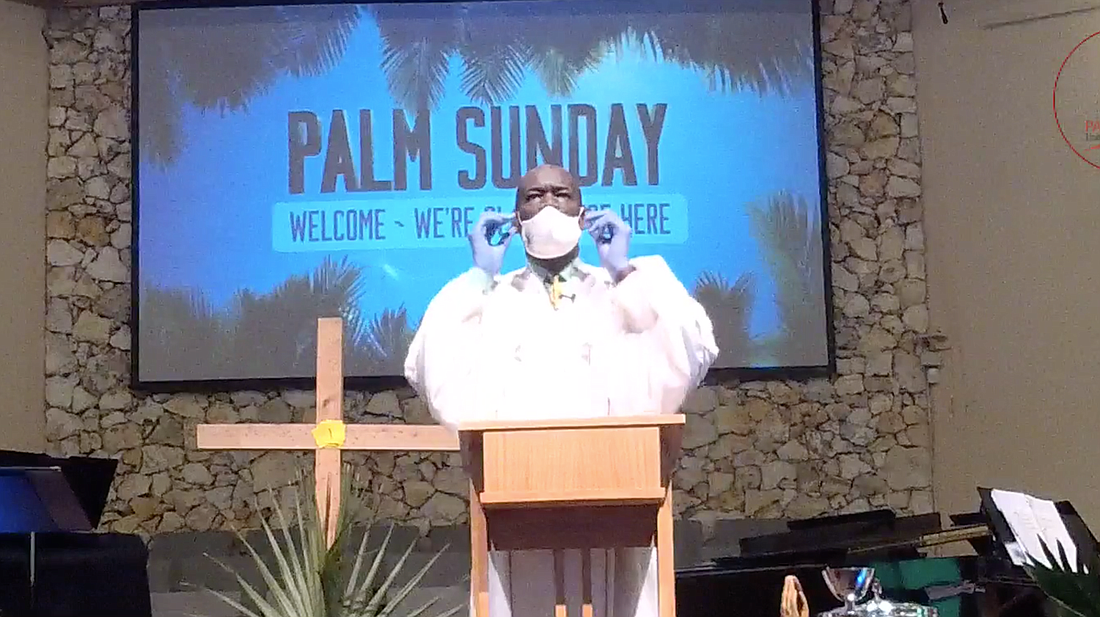 The Rev. Kevin James streamed his sermon on April 5 via Facebook, wearing a mask and gloves. Facebook screen capture