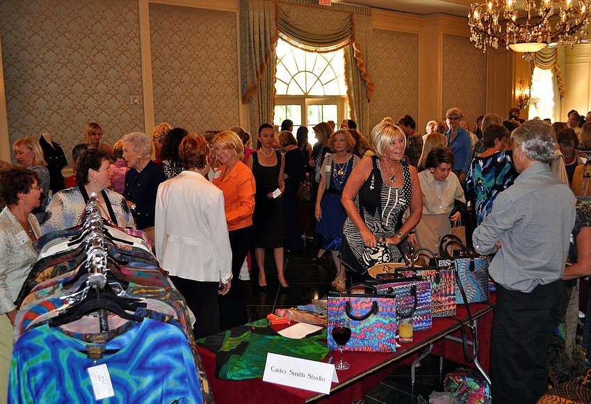People wandered around the boutique that was set up in the lobby prior to the Women's Resource luncheon.