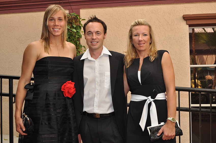 Nina Bratchikova with Torsten and Kveta Peschke, who won the 23rd WTA doubles title at Sydney, Australia.