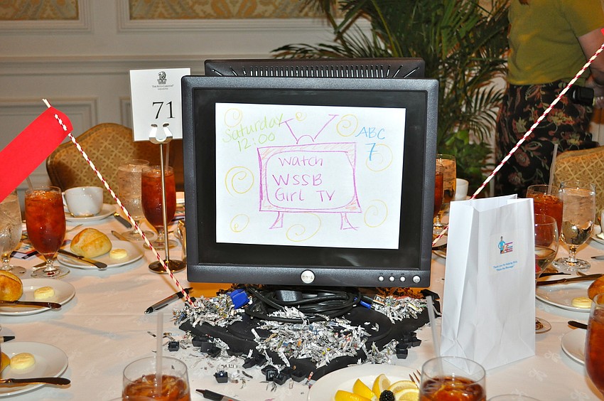 Media centerpieces focused on newspapers, magazines, film, social media and television filled tables.