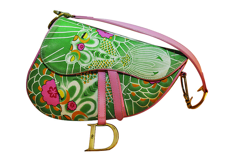 CHRISTIAN DIOR
<br><br>
â€œThe saddlebag shape is very â€˜60s retro. I think thatâ€™s what fashion is â€” taking something thatâ€™s retro and re-imagining it.â€