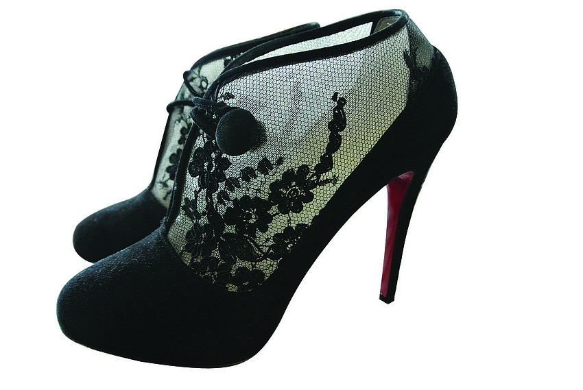 CHRISTIAN LOUBOUTIN CLIC CLAC LACE BOOTIE
<br><br>
â€œI thought they were stunning with the lace-and-button detail and the signature Louboutin bottom.â€