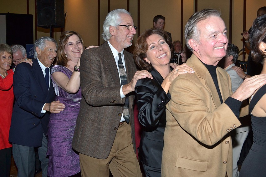 Guests gathered on the dance floor and formed a conga line.