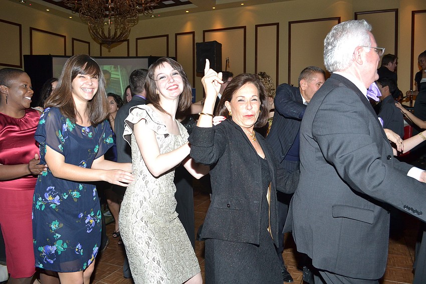 Guests gathered on the dance floor and formed a conga line.