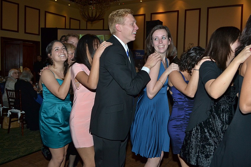 Guests gathered on the dance floor and formed a conga line.