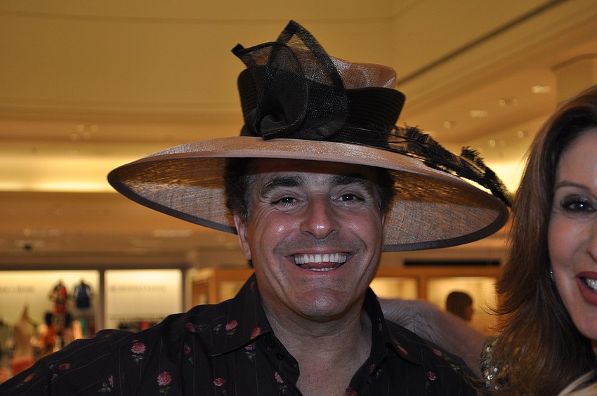 Monte DeCarlo tries on a hat.