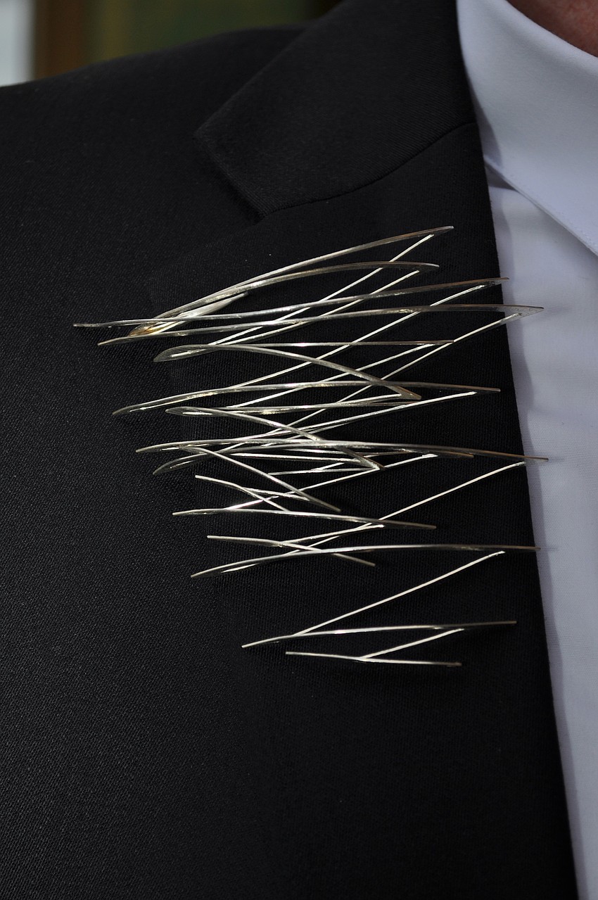 Tim Cameresi wore a Dream Weaver broach.