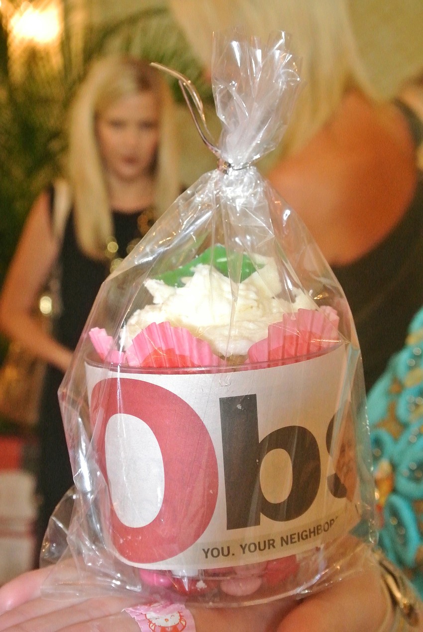 An Observer Group cupcake