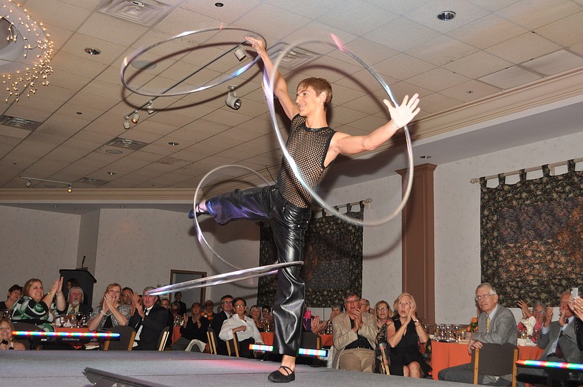 A Circus Sarasota performer shows off his hula hoop skills.