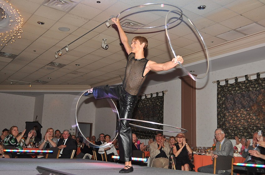A Circus Sarasota performer shows off his hula hoop skills.