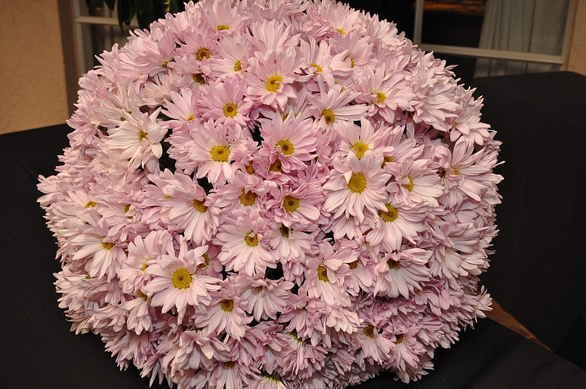 A pretty pink ball of flowers hung above Lyndsy McDonald's table.