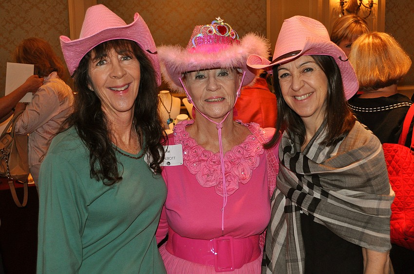 Dr. Katie Hayes, Pat Talbott and Elizabeth Manzi celebrated Talbott's 80th birthday while attending the Women's Resource luncheon.