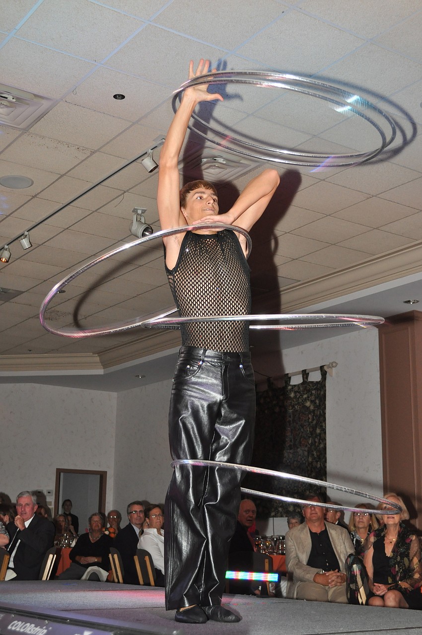 A Circus Sarasota performer shows off his hula hoop skills.