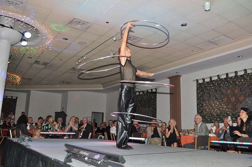 A Circus Sarasota performer shows off his hula hoop skills.