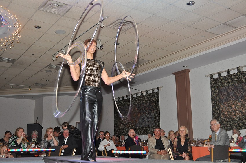 A Circus Sarasota performer shows off his hula hoop skills.