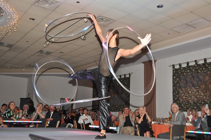 A Circus Sarasota performer shows off his hula hoop skills.
