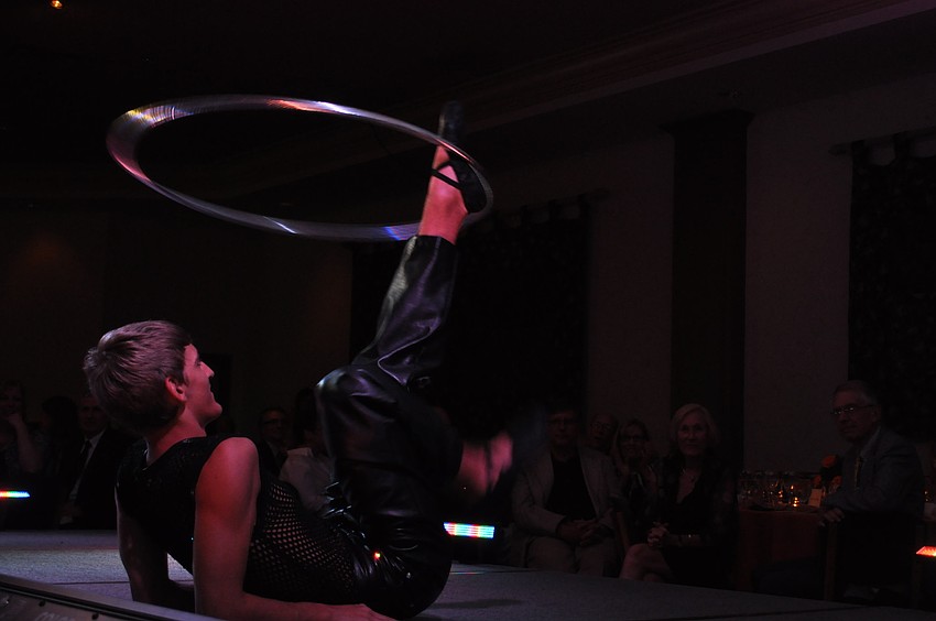 A Circus Sarasota performer shows off his hula hoop skills.