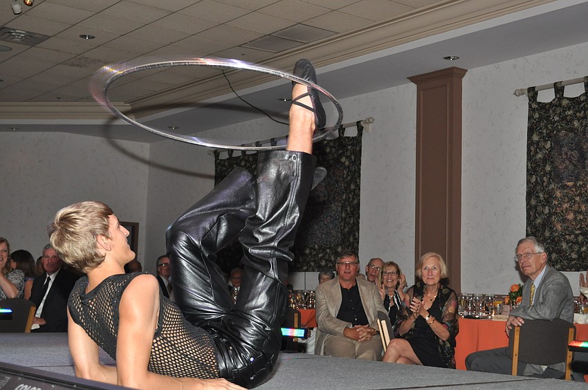 A Circus Sarasota performer shows off his hula hoop skills.
