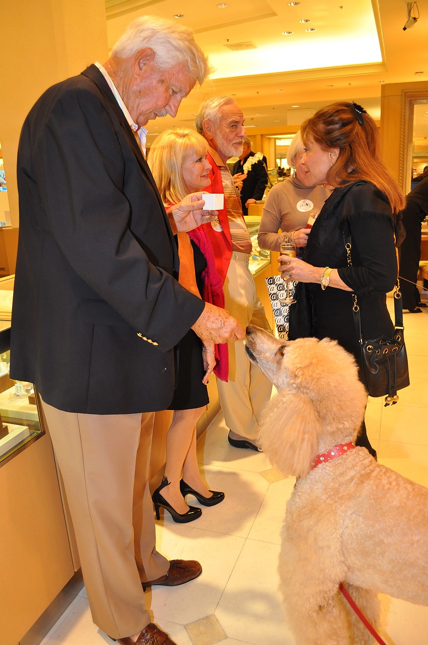 John Hunter feeds Behta some of his dessert.