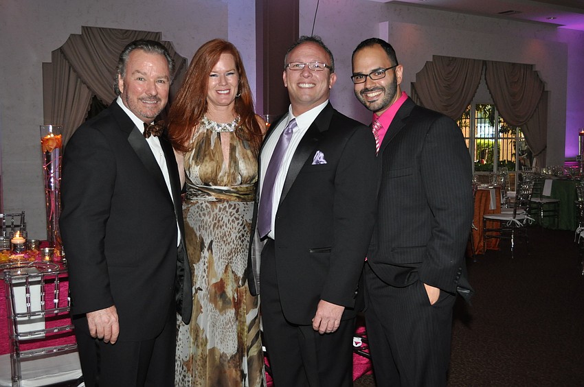 Michael and Terri Klauber, Chairman Jim Wilson and Roger Capote