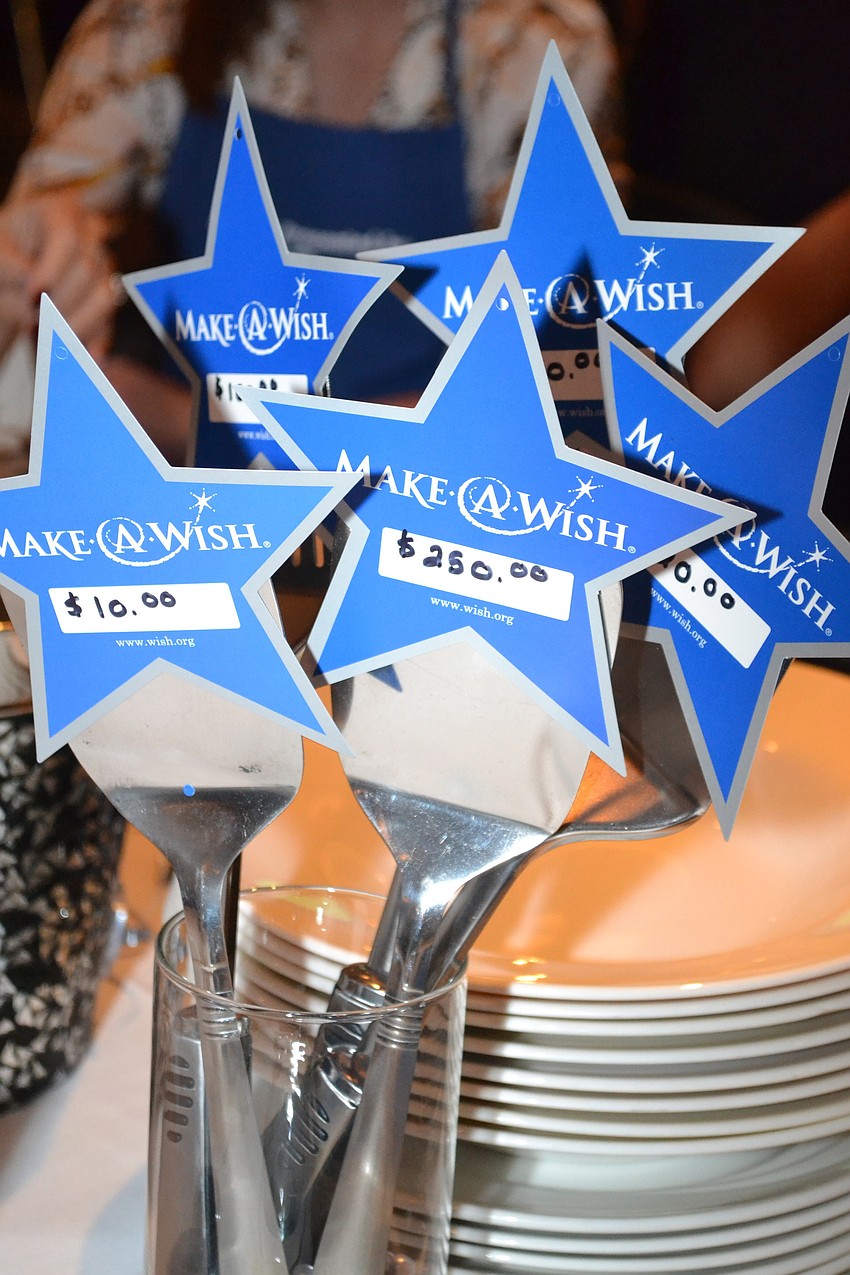 Susan Jones was the first person to raise her paddle at this year's event.