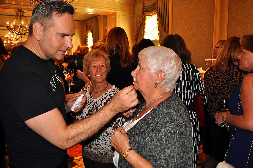 June Houlton tries out one of Niko Papadatos' products.