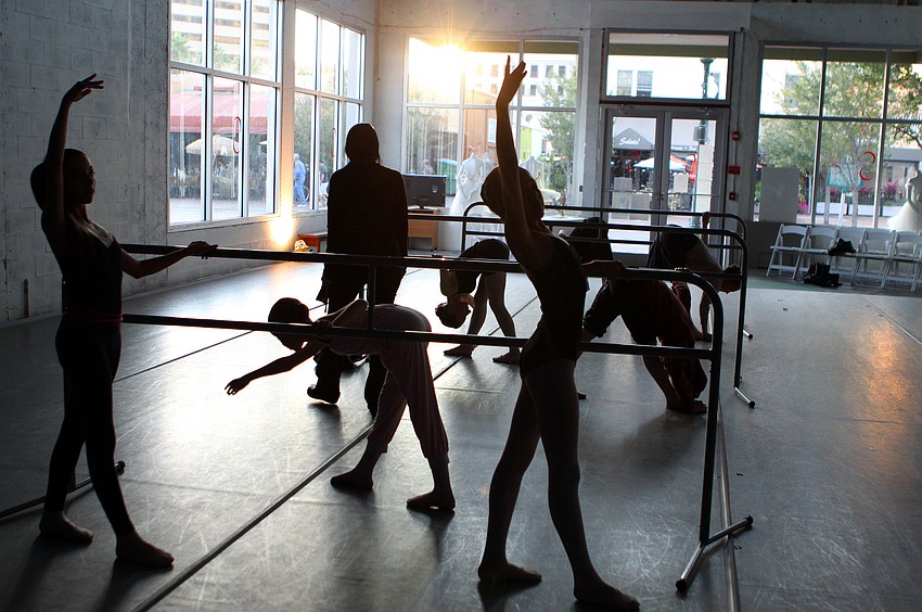 Isabel Dubrocq makes her way around the room as the girls run through some moves at the barre, Friday, Jan. 6, inside Studio 20.
