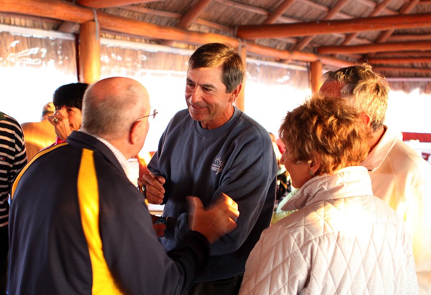 Dave Sparks talked with many groups of people at his goodbye party.