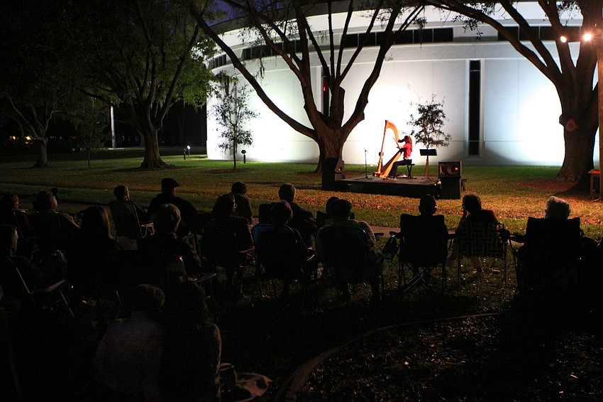 Cheryl Losey, principal harpist in the Sarasota Orchestra, played pieces inspired by different readings, Friday, Jan. 6, during 