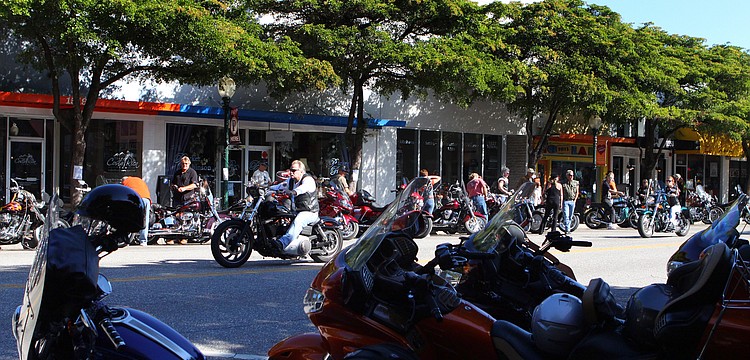 Bikers make their way through downtown Sarasota, Sunday, Jan. 8, during the weekend long event, Thunder by the Bay.