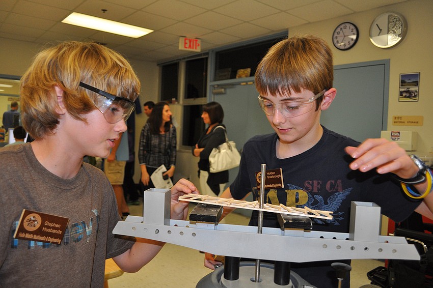 Technology students Stephen Husbands and Holden Scarbrough demonstrated how to make and test a balsa wood bridge.