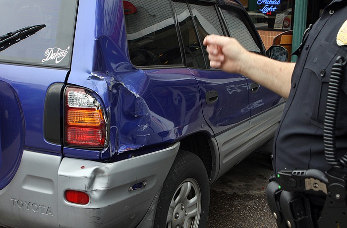Five cars, including the Dodge Caravan, were hit. Photo by Rachel S. O'Hara.